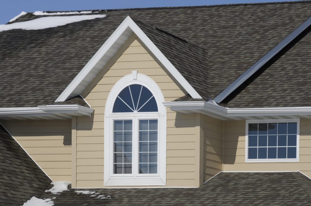 House with beige vinyl siding.