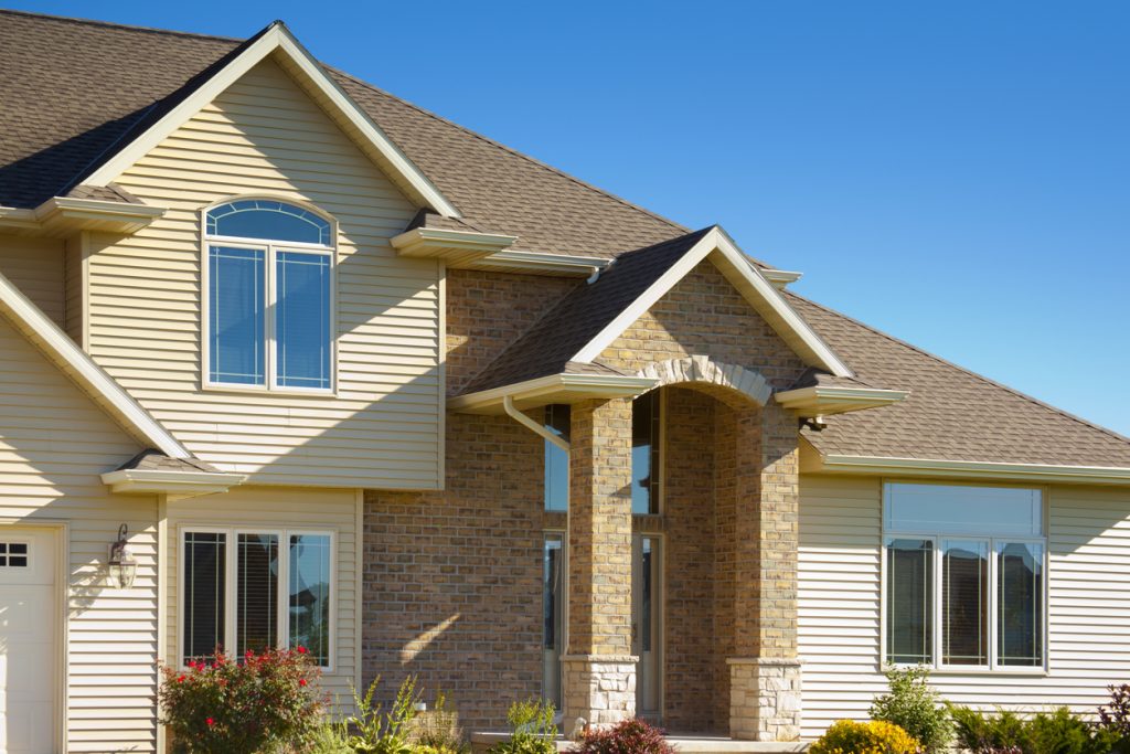 Mixed Materials House With Stone, Brick, Vinyl Siding